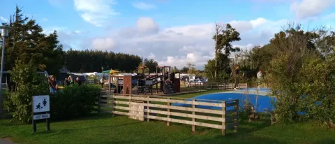 Playground and bouncing pillow at Tornby Strand Camping holiday park in North Jutland, Denmark, sunny day.