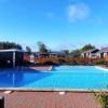 Outdoor swimming pool with slide at Tornby Strand Camping, a holiday park in North Jutland, Denmark.