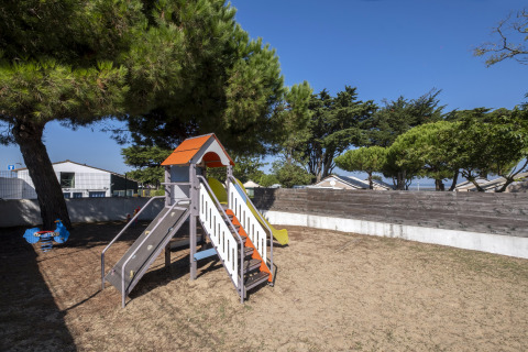Playground with slide and swings at Flower Camping Le Platin - La Redoute, Île de France, France.
