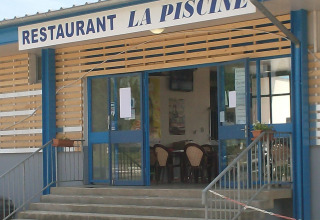 Entrance of Restaurant La Piscine at Onlycamp Camping de Besançon, holiday park in Bourgogne-Franche-Comté, France.