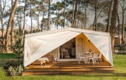 Coco Sweet Comfort safari tent at Flower Camping Le Platin - La Redoute, France, with furnished terrace.