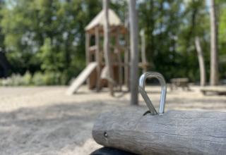 A playground with wooden structures and sand, pictured at Holiday park Latour in North Brabant, Netherlands.
