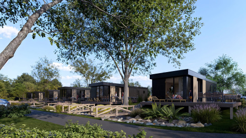Modern lodges with hot tubs at Valkhof, Veluwe park de Bosgraaf, Netherlands, surrounded by greenery and trees.