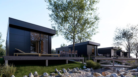 Moderne lodges met houten terrassen en ligstoelen aan het water in Valkhof met Hottub, Veluwe park.
