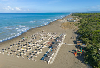 Aerial view of a beautiful beach and resort area at Sandaya Etruria holiday park in Tuscany, Italy.