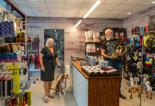 Customers with dogs shop at a pet store in Sandaya Europa Village holiday park in Veneto, Italy.
