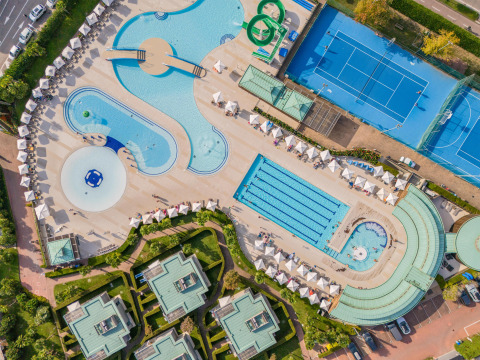 Aerial view of Sandaya Europa Village in Veneto, Italy, showing pools, tennis courts and holiday lodges.