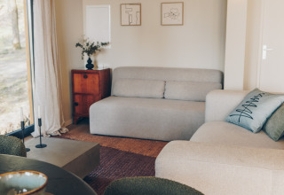 Bright, modern living room in the Beach Side Scandi lodge at Wilsumer Berge, Germany.