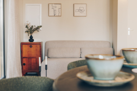 Living room at Beach Side Scandi lodge in Wilsumer Berge, Germany, featuring minimalist, modern decor style.