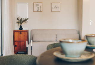 Living room at Beach Side Scandi lodge in Wilsumer Berge, Germany, featuring minimalist, modern decor style.