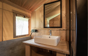 Bathroom with sink and mirror inside a Safari tent Lake + sanitary at Family park Goolderheide, Belgium.