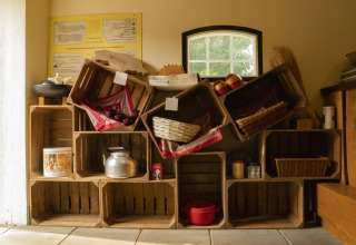 Wooden crates and kitchen items displayed under a window at BoerenBed Het Boshuis, Gelderland, Netherlands