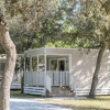 Modern glamping lodge at Sentido Toscane Premium Camp – Lodges Toscane, nestled among trees and nature.
