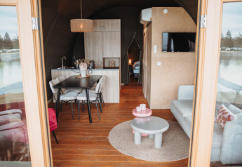 Interior view of a water lodge at Recreation park De Achterste Hoef, Netherlands, with modern furnishings.