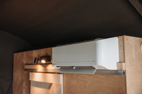 Air conditioning unit mounted on wall at Water lodge, Recreation park De Achterste Hoef, Netherlands.