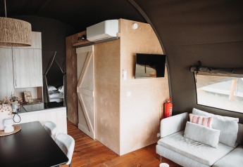 Interior view of a cozy Water lodge at Recreation park De Achterste Hoef in the Netherlands, modern furniture.
