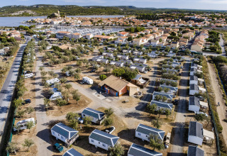 Aerial view of Seasonova Camping Barberousse holiday park with cabins and mobile homes in Occitanie, France.
