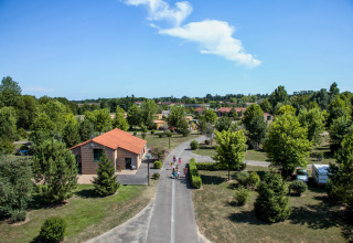 Aerial view of Onlycamp Camping le Champ d'Été holiday park in Auvergne-Rhône-Alpes, France, with trees.