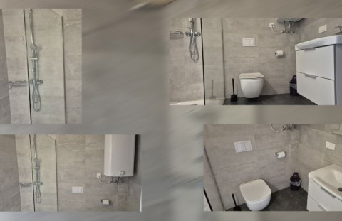 Modernes Badezimmer mit Dusche, WC und Waschbecken in Seecamping Kleblach-Lind – Lodges Karinthië.