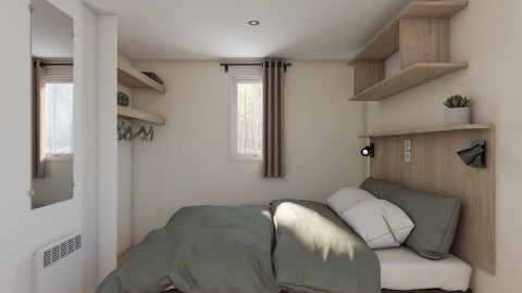 Bedroom in a static caravan Comfort with air conditioning at Seasonova Camping Le Plan d’Eau, France.