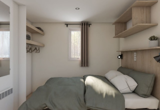 Bedroom in a static caravan Comfort with air conditioning at Seasonova Camping Le Plan d’Eau, France.