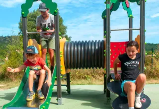 Children enjoy slides and playground activities at Seasonova Camping Les Prés du Verdon in the south of France.