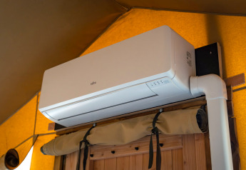 Air conditioning unit installed inside the Compact safari tent at Camping de Molenhoek in the Netherlands.