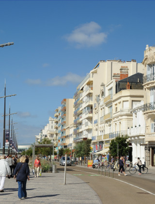 People walking along the seaside promenade near Saint Julien des Landes in Pays de la Loire, France.