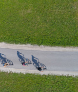 aerial photo 4 cyclists on bike path