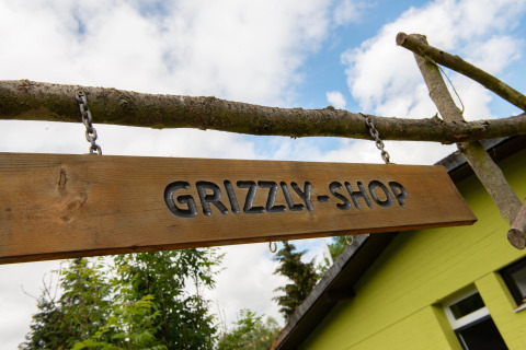 Signboard Grizzly shop Camping Donnersberg in Gerbach, Rheinland-Pfalz, Germany