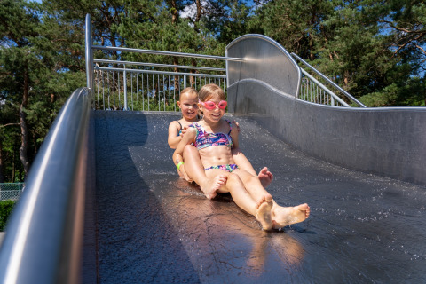 Kids on slide pool - Vodatent - Recreation and Nature Park de Keiheuvel - Balen - Antwerp - Belgium