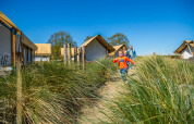 Family between glamping tents - EuroParcs Zuiderzee - Biddinghuizen, Flevoland, Netherlands