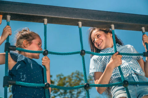 Girls in rope climbing frame - EuroParcs De Rijp - West Graftdijk, North Holland, Netherlands