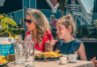 Mother and daughter on terrace - EuroParcs De Rijp - West Graftdijk, North Holland.