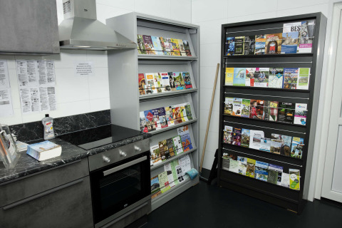 Kitchen area at Costa Kabrita holiday park in North-Brabant, Netherlands, with brochure shelves.