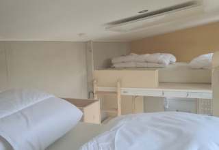 Interior photo of a Tiny House at Vakantiepark 't Urkerbos, Netherlands, featuring stacked bunk beds.