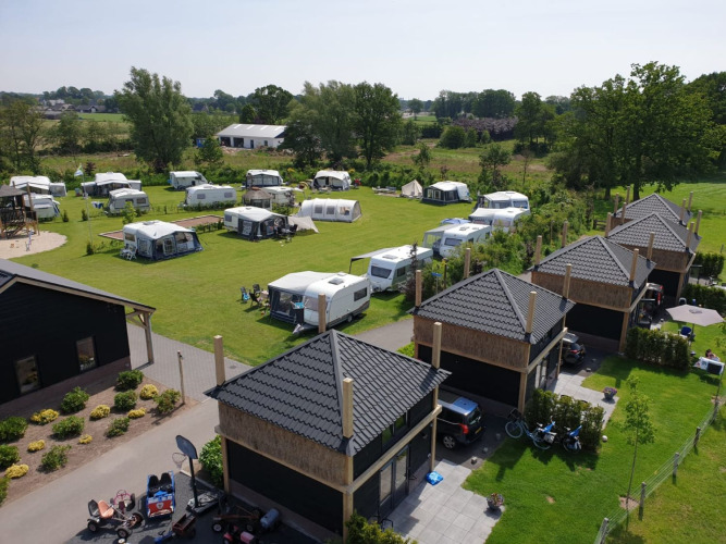 Aerial view of Camping Nieuw Romalo holiday park in Gelderland, Netherlands, with caravans and lodges.