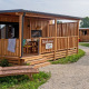 Imagen exterior de SunLodge BigLeaf en Camping Terme Catez, Eslovenia, con terraza de madera y tumbonas.