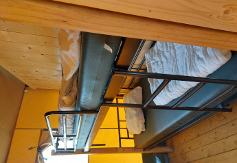 A photo of bunk beds inside a glamping safari tent at Camping De Gouwe Stek in the Netherlands.