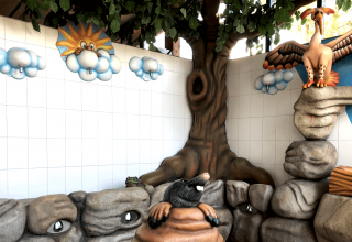 Aire de jeux avec statues d’animaux, fresques murales colorées et rochers artificiels à Vakantiepark De Luttenberg, Overijssel.