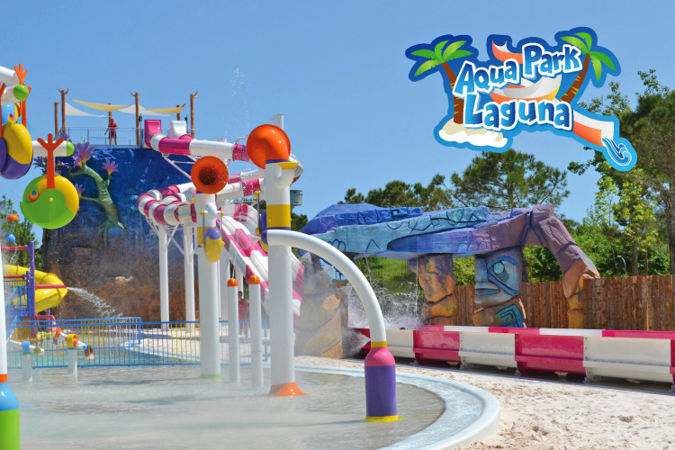 Colorful view of Aqua Park Laguna water park at Camping Union Lido Mare, Veneto, Italy, with water slides.