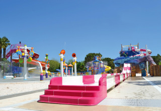 Water park at Camping Union Lido Mare in Veneto, Italy, featuring colorful slides and interactive splash area.