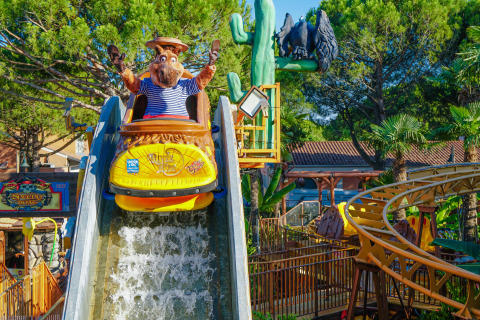 A mascot on a log flume ride at Union Lido Mare holiday park in Veneto, Italy, enjoying the descent.