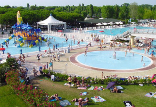 Holiday park with large swimming pools, kids’ water play area at Camping Village Marina di Venezia in Italy.