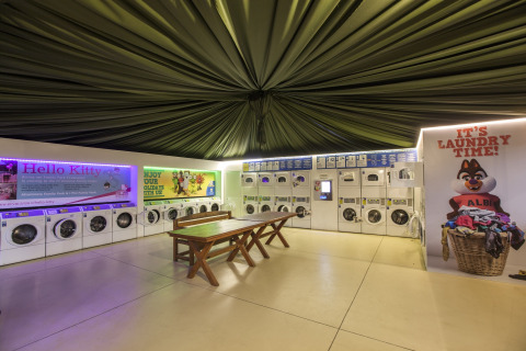 Self-service laundry room at hu Park Albatros Village, a family holiday park located in Tuscany, Italy.