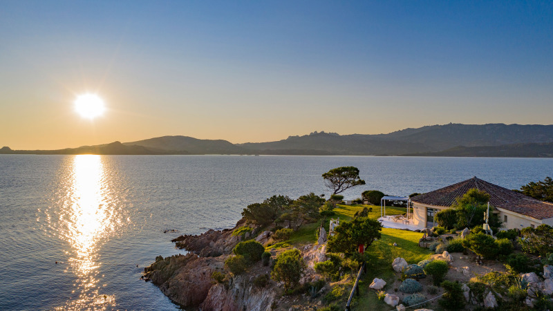 Sunset over the sea at Centro Vacanze Isuledda, a holiday park in Sardinia, Italy, with coastal scenery.
