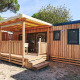 Udendørsbillede af SunLodge Sabai med træterrasse, overdækning og moderne design omgivet af natur.