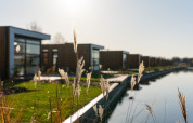 Modern holiday homes by the water at MarinaPark Residentie Nieuw Loosdrecht, North-Holland, Netherlands.