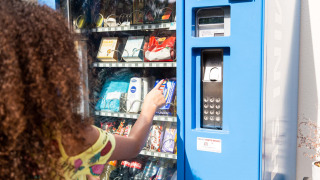 A person selects a snack from a vending machine at Résidence de Leuvert holiday park in North Brabant, Netherlands.