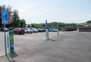 Electric car charging stations and parking area at Résidence Valkenburg holiday park in Limburg, Netherlands.